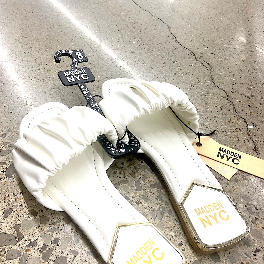 Cute, never worn white NYC female slides.